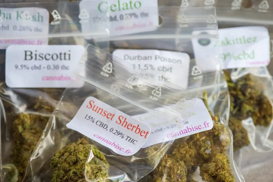 An assortment of packaged flower strains in labeled bags