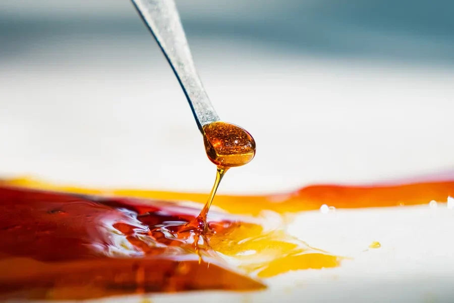 Close-up shot of wax, being scooped, just one form of many types of THCa concentrates.